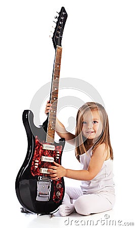 Small child hold red acoustic guitar. Music Stock Photo