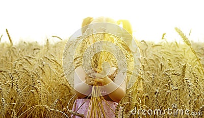 The small child plays in the field Stock Photo