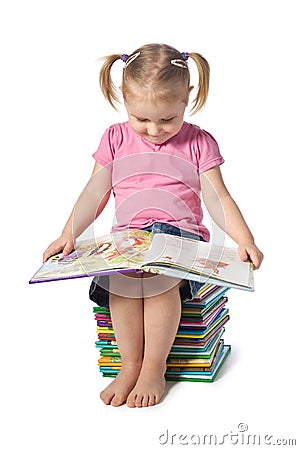 Small child reading a book Stock Photo