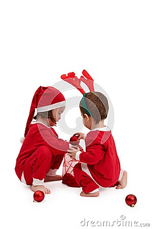 Small children in santa costume playing Stock Photo