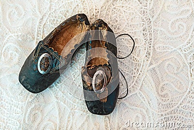 Small children shoes on a lace background Stock Photo