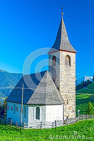 Small church in alpine village Stock Photo
