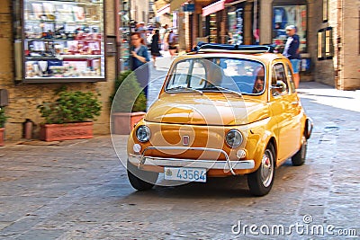 Small city car Fiat 500 on the street in Italy Editorial Stock Photo