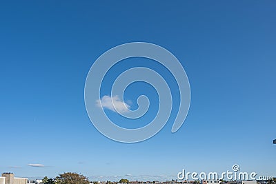 A small cloud over the city scape horizon Stock Photo