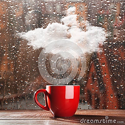 Small cloud raining into a cup Stock Photo