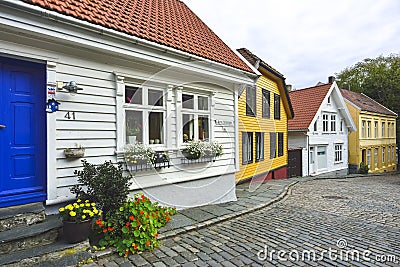 Traditional cobblestone street with wooden houses in the old town of Stavanger, Norway Editorial Stock Photo