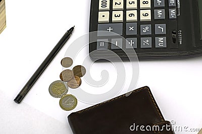 Small coins wallet calculator and fountain pen on sheets of white paper on the table concept business budget economy Stock Photo