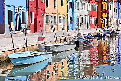 Small colored houses and the boats in sunny summer day, Venice Burano island, Italy. Stock Photo