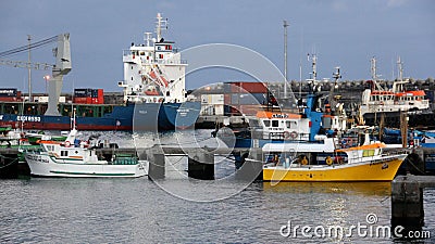 Small colorful fishing boats moored at the pier of the fishing port, Ponta Delgada, Sao Miguel, Azores, Portugal Editorial Stock Photo