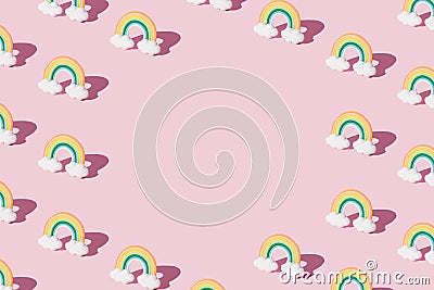 Small colorful rainbow cookie with clouds. Pattern. Pink background. Copy space Stock Photo