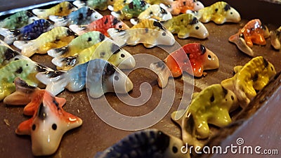 Small colourful ceramic fishes Stock Photo