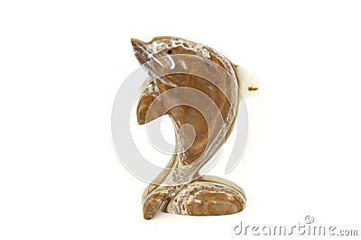 Lifelike model of a little stone dolphin. Home and office decoration Toy. Stock Photo