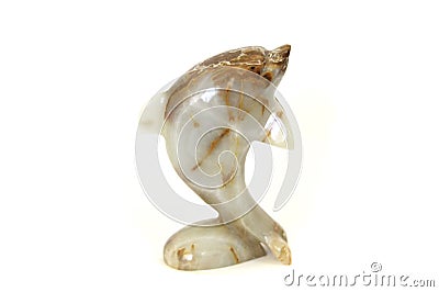 Lifelike model of a little stone dolphin. Home and office decoration Toy. Stock Photo