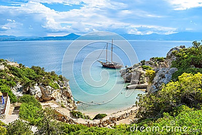 Yacht in small cove. Stock Photo