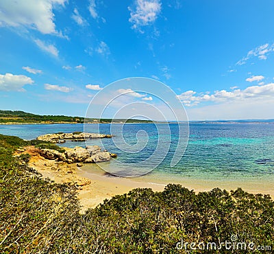 Small cove under a blear sky in Sardinia Stock Photo