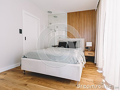 Small cozy bedroom with comfortable bed Stock Photo