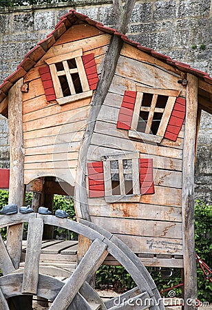 Small crooked playhouse on public playground Stock Photo