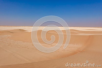 Small cross desert dunes golden on the horizon limestone expanse Stock Photo