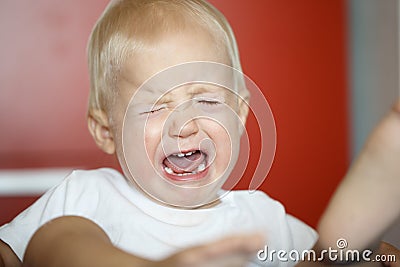 Small, crying and raging toddler having a temper tantrum Stock Photo