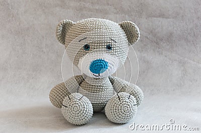 Small cute crochet bear toy. Stock Photo