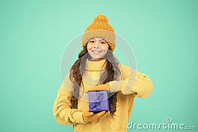 Small cute girl received holiday gift. Enjoy receiving presents. Christmas gifts for kids. Kid little cheerful girl hat Stock Photo