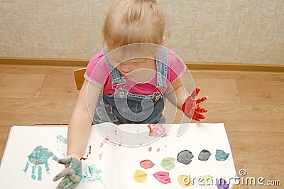 Small cute painting girl Stock Photo