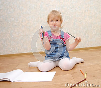 Small cute painting girl at home Stock Photo