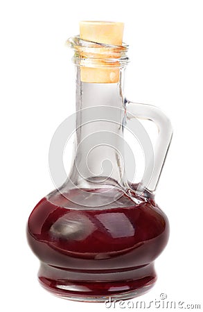 Small decanter with red wine vinegar isolated on w Stock Photo