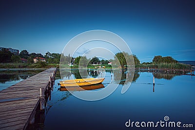 Small Dock and Boat at the lake Stock Photo