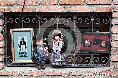 Small dolls in traditional Georgian cloths and paintings in Tbilisi, Georgia. Editorial Stock Photo