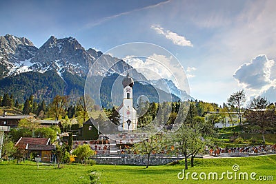 Small domed church with Wetterstein in Grainau village Germany Stock Photo