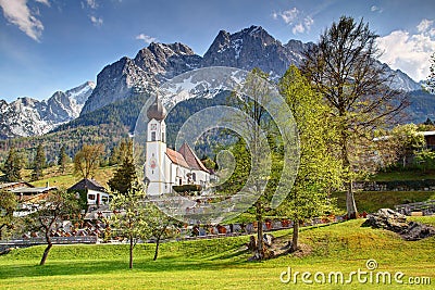 Small domed village church with Wetterstein in Grainau Bavaria Stock Photo