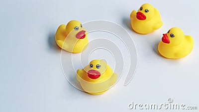 Small ducks yellow made from plastic for children, has a sound for baby playing in bathtub. Funny toy for development the kids. Stock Photo