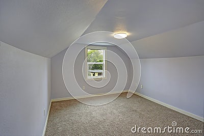 Small empty blue bedroom accented with vaulted ceiling Stock Photo