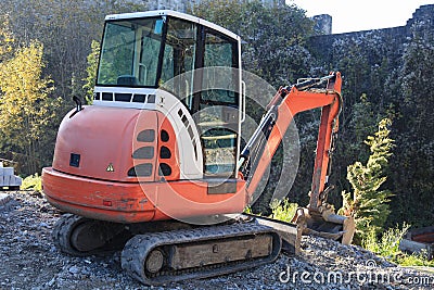 Small excavator on construction site Stock Photo