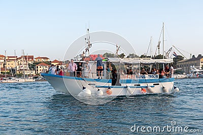 Small ferry approaching harbor Editorial Stock Photo