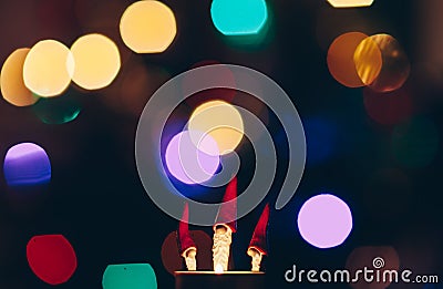 Small figures of three Christmas magicians with long beard and tall cap by fire Stock Photo