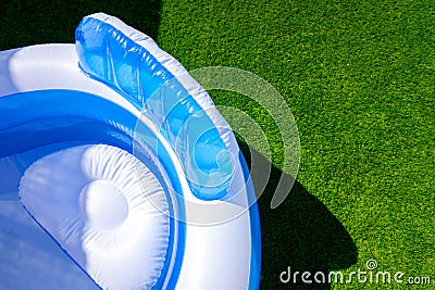 A small fillable plastic, rubber pool in an outdoor garden Stock Photo