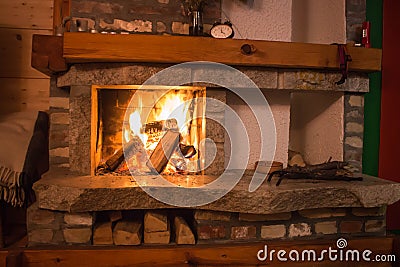 Small fireplace in accommodation in cottage Stock Photo