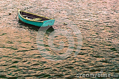 Small Fishing Boat in Bay Editorial Stock Photo