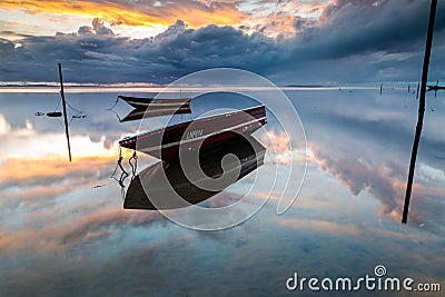 A small fishing boat boomed in the morning. Stock Photo