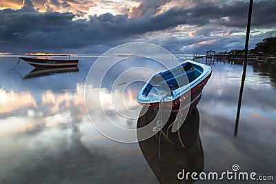 A small fishing boat boomed in the morning. Stock Photo