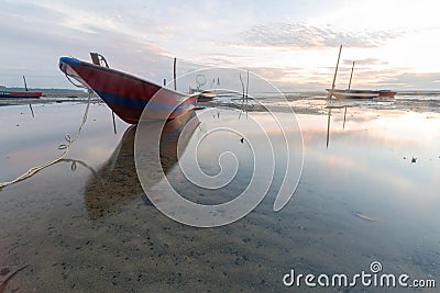 A small fishing boat boomed in the morning. Stock Photo