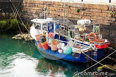 Small fishing boat in harbour Stock Photo