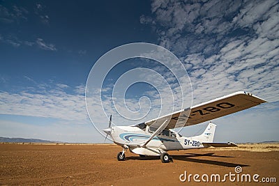 Small flight to carry tourist from Nairobi to Masai mara at Masai Mara Air Strip,Kenya Editorial Stock Photo