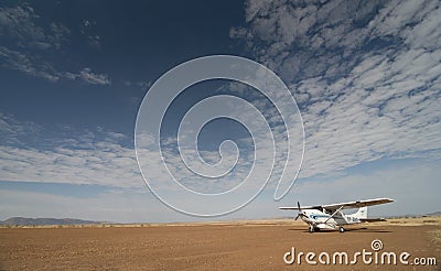 Small flight to carry tourist from Nairobi to Masai mara at Masai Mara Air Strip,Kenya Editorial Stock Photo