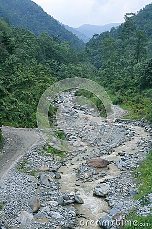Small flow of water through rocks in Sikkim, India Stock Photo