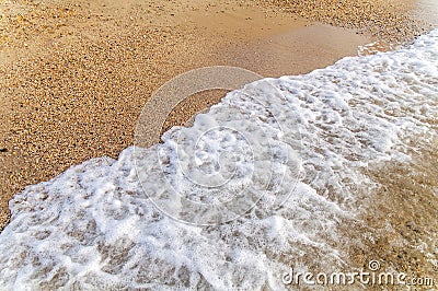 Small foam sea wave close background Stock Photo
