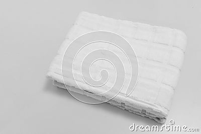 Small folded towels isolated on white background. Squared patte Stock Photo
