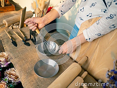 Small gardening Tools. Classic wooden rolling pin. mixer and pan Stock Photo